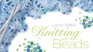 Add sparkle and shine to your lace! Laura Nelkin shows you how easy and rewarding it is to incorporate beads into your knitting projects.